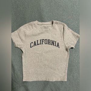 Women’s top/tee size L but fits like a Small